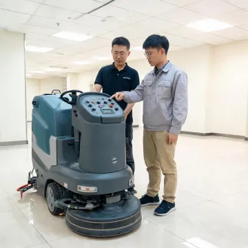 Operator trainer explaining floor scrubber controls